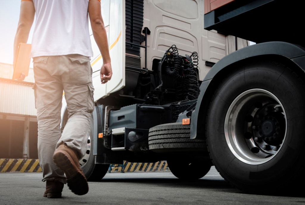 truck driver holding folder going to truck