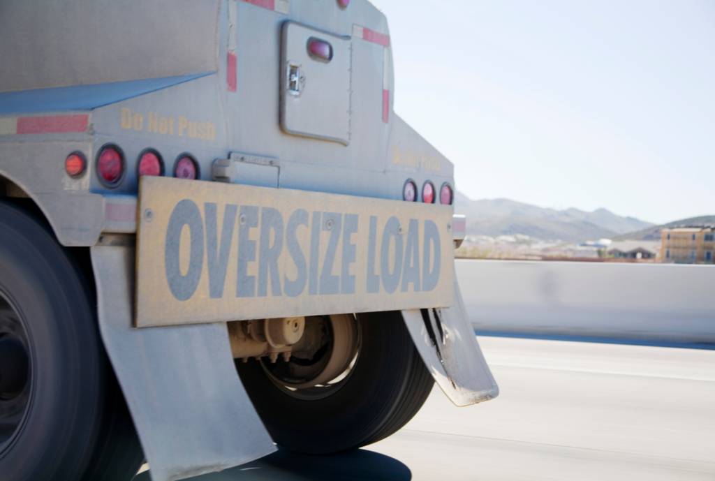 oversized load truck with banner