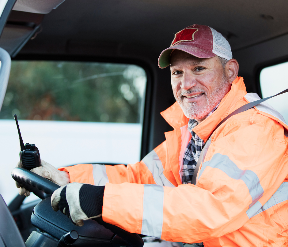 a male truck driver wearing orange jacket