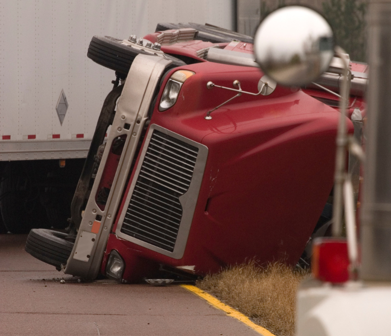 red semitruck accident on the road