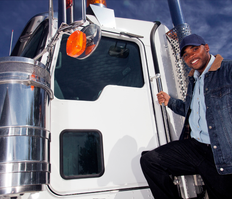 truck driver holding on a white trailer