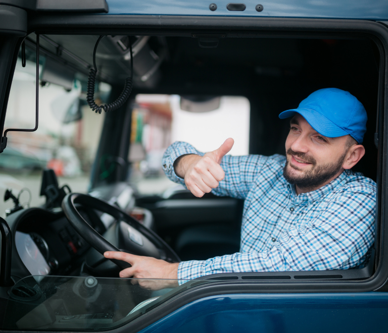 truck driver wearing blue cap in truck driver inspecting trailer for safety