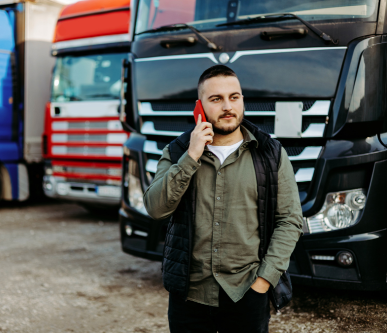 truck-driver-holding-phone-to-call