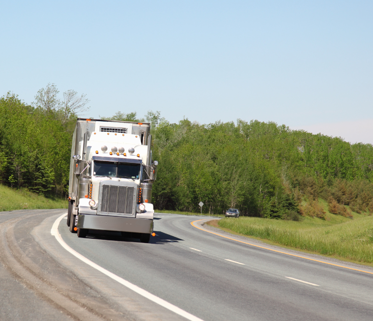 white semi truck in the road