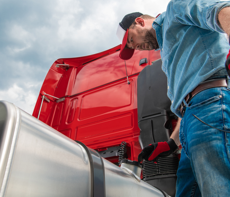 truck driver putting gas