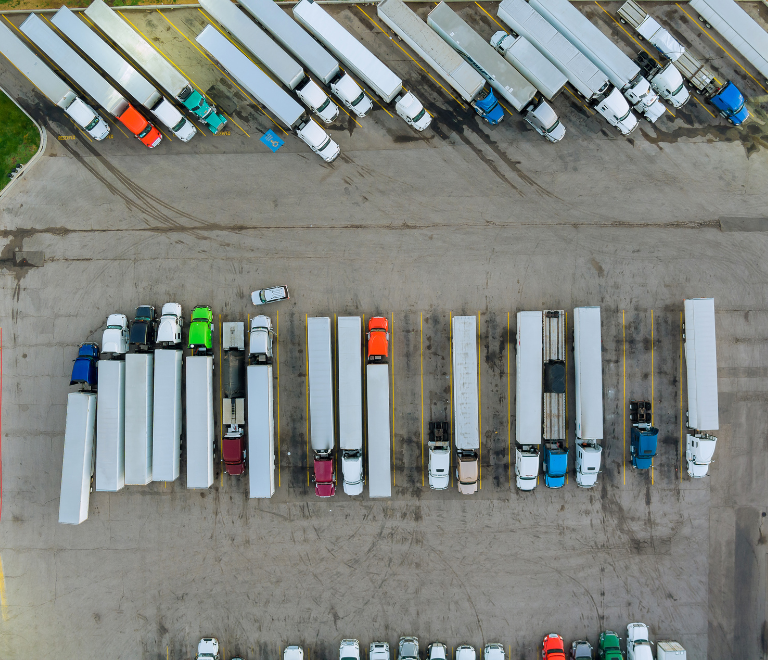 aerial top view of parked semi trucks