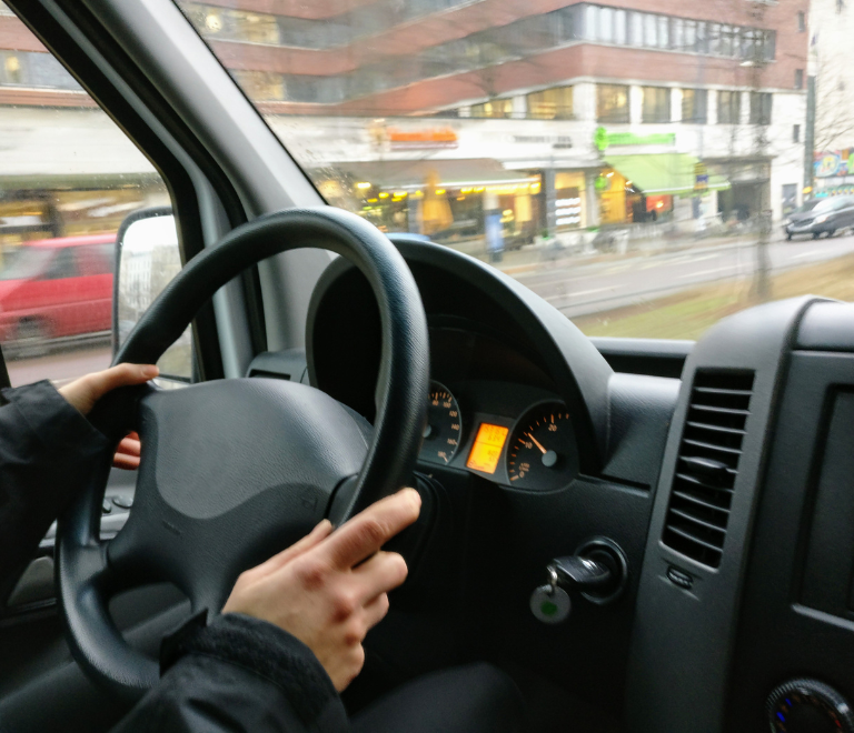 truck driver holding steering wheel