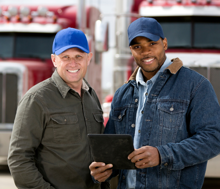 two truck drivers holding ipad