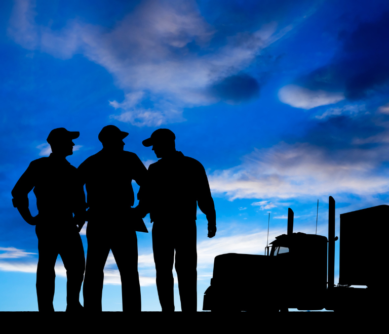 three truck drivers silhouette