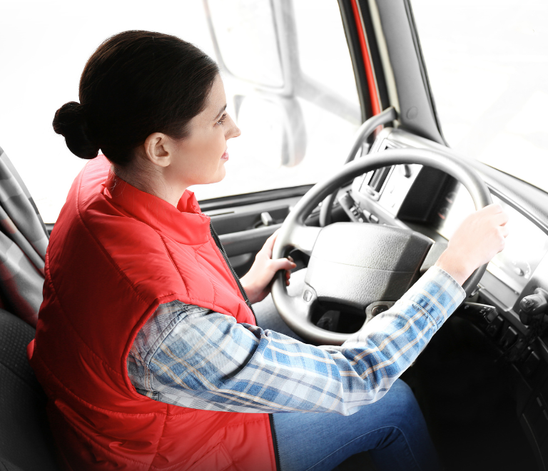 female truck driver driving a truck