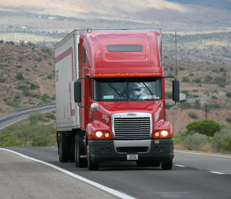 a red truck on the road