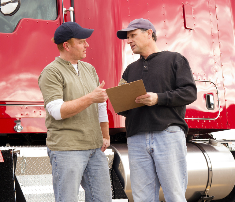 a two truck driver reviewing