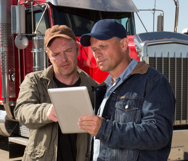 truckers checking ELD in tablet