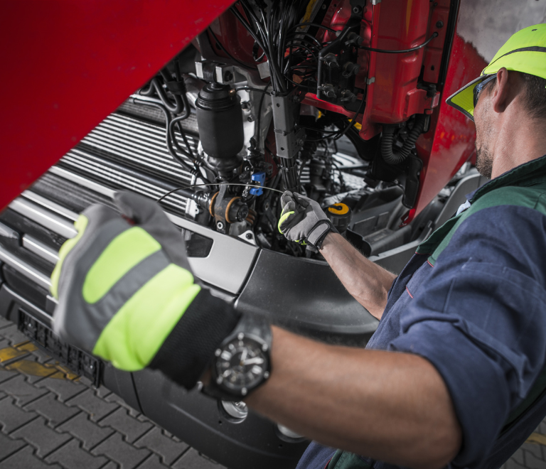 truck driver doing repair maintenance