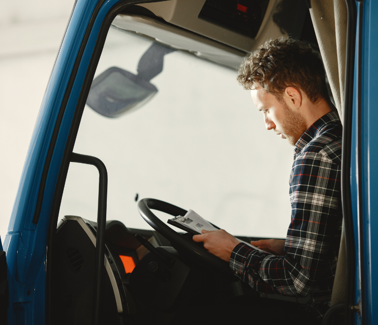 truck driver updating maintenance logs